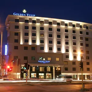 Golden Tulip Отель